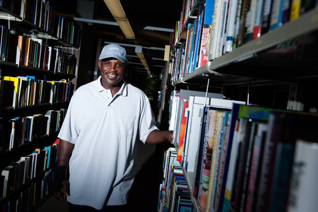 Ricky Stephens stands for a portrait in the library on campus at the Sandhills Community College on Wednesday, July 22, 2015 in Southern Pines, North Carolina. Stephens is a janitor at the college, but plays pickle ball in his free time and regularly competes.