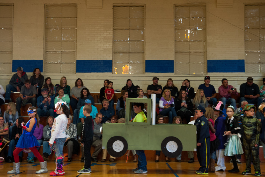 Students walk as various characters during the Halloween Costume parade in the gymnasium of High Falls Elementary School on Friday, October 30, 2015 in Robbins, North Carolina.