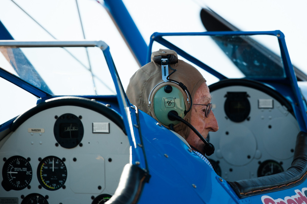 Larry Deister waits in the co-pilot's seat in Darryl Fisher's Boeing Stearman before his Ageless Aviation plane ride at the Moore County Airport on Tuesday, September 1, 2015 in Whispering Pines.