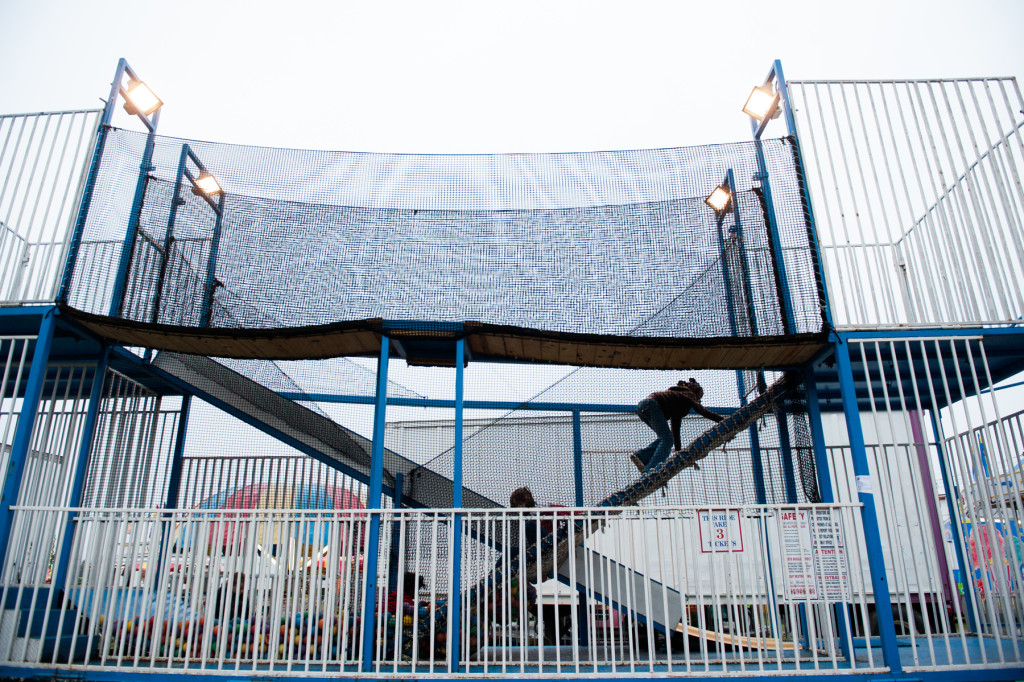 Children are seen climbing and playing in a jungle gym type of ride at the Moore County Fair on Thursday, October 1, 2015 in Carthage, North Carolina.