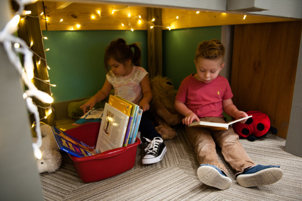 Kialee Lopez and Liam Lambert flip through books in a little reading nook at HOPE Academy, a recently opened pre-school, on Wednesday, September 16, 2015 in Robbins, North Carolina.