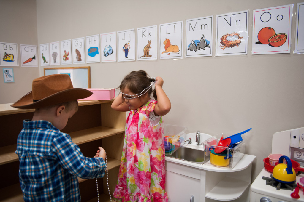 West Williams and Kialee Lopez play dress up at HOPE Academy, a recently opened pre-school, on Wednesday, September 16, 2015 in Robbins, North Carolina.