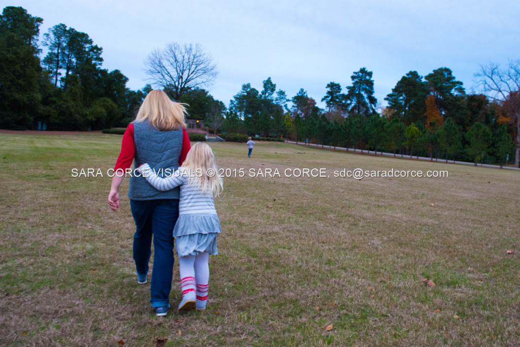 Greg and Lucy Noble stand for family portraits with their children Wesley and Kate at the Pinehurst Arboretum Park on Sunday, November 16, 2015 in Pinehurst, North Carolina.