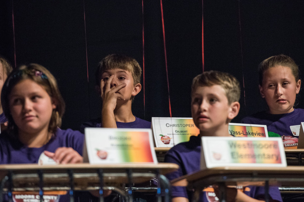 Christopher Gilbert (center, background), of Vass-Lakeview Elementary, reacts with his teammates after missing a question during the "Are you Smarter than a Fifth Grader" Contest at Pinecrest High School on Thursday, November 12, 2015 in Southern Pines, North Carolina.