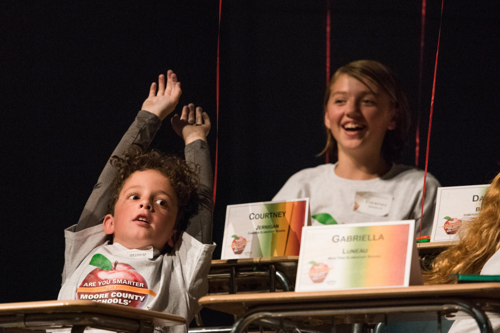 Marco Wellner celebrates with his team during the "Are you Smarter than a Fifth Grader" Contest at Pinecrest High School on Thursday, November 12, 2015 in Southern Pines, North Carolina.