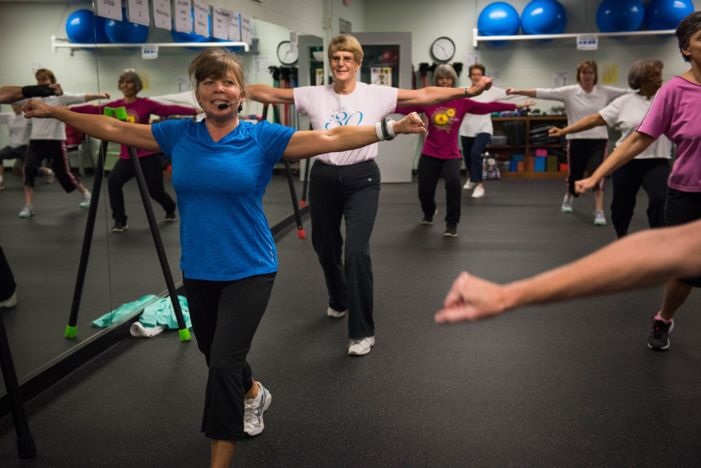 Instructor Esther Zollman (left) has the class follow her during a Tabata class at the Senior Enrichment Center on Monday, November 23, 2015 near West End, North Carolina.