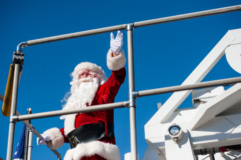 Santa Claus waves from the top of a fire truck during the Southern Pines Christmas Parade that took place down the south side of Broad Street on Saturday, December 5, 2015 in Southern Pines, North Carolina.