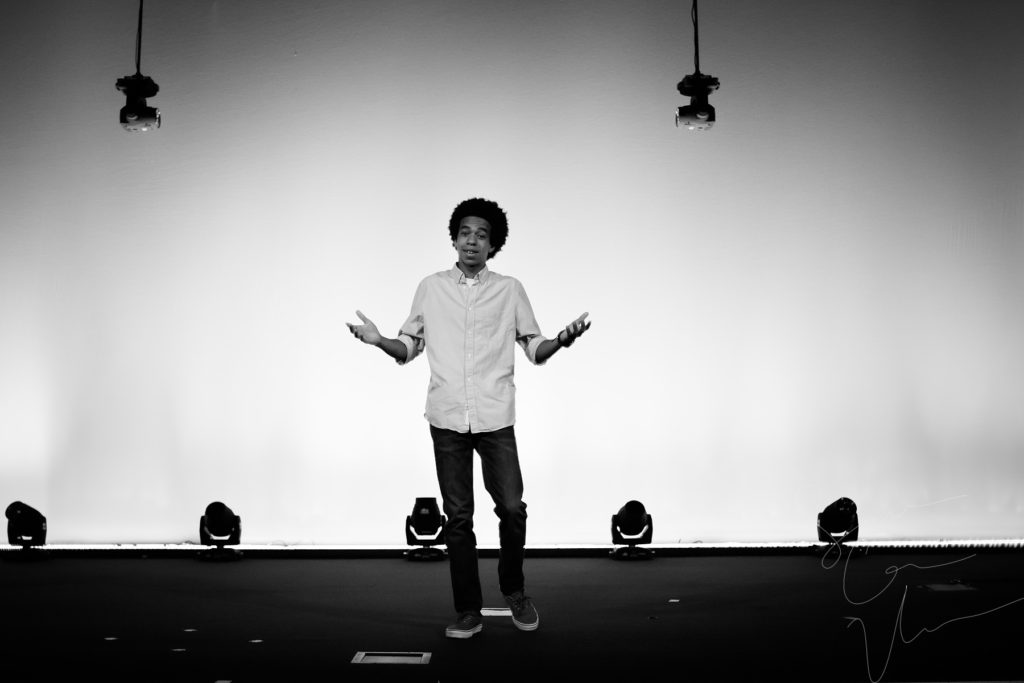 SARA CORCE/Sara Corce Visuals Caleb Elliott stands on stage, going through bits of a comedic routine, for headshots and portraits on Tuesday, April 26, 2016 in Southern Pines, North Carolina. WEBSITE BW