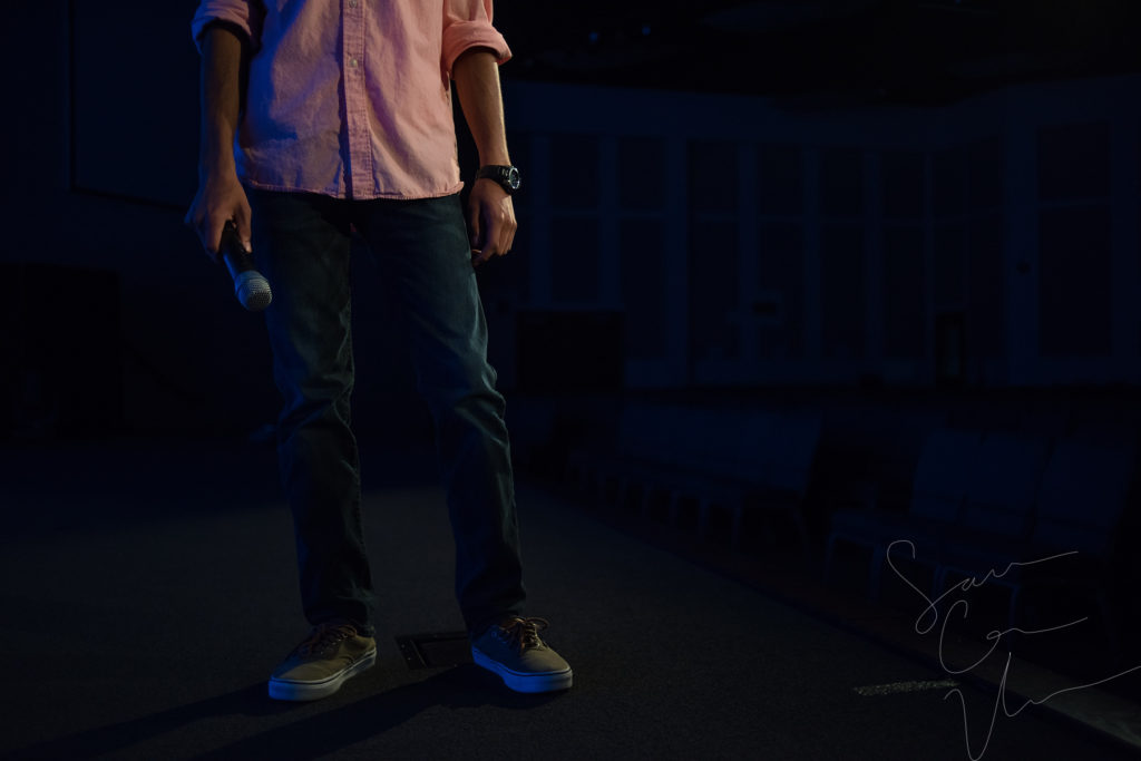 SARA CORCE/Sara Corce Visuals Caleb Elliott stands on stage, going through bits of a comedic routine, for headshots and portraits on Tuesday, April 26, 2016 in Southern Pines, North Carolina. WEBSITE CLR